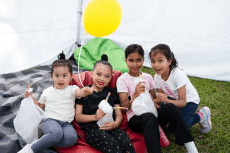 children sitting on beanbag