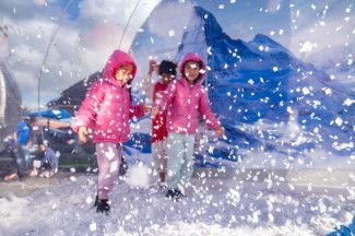 Children inside snow globe