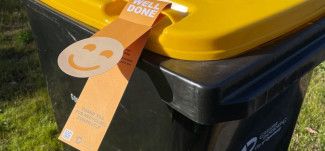 image of recycling bin with well done tag