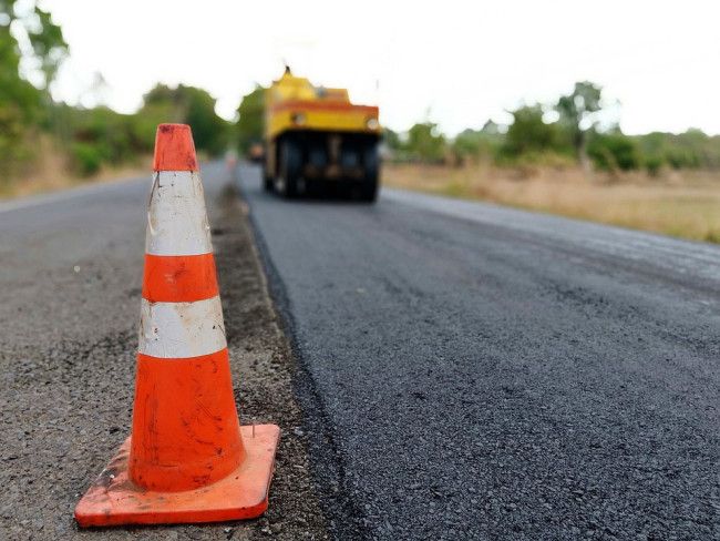 Construction of a road with a safety cone