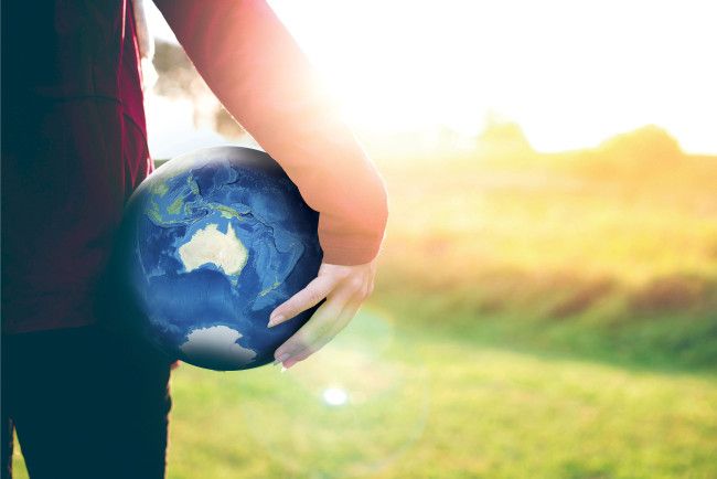 hand holding a globe