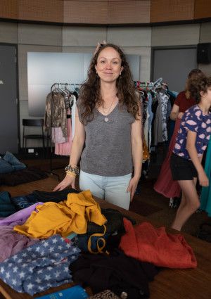 Person standing in front of a clothing stall