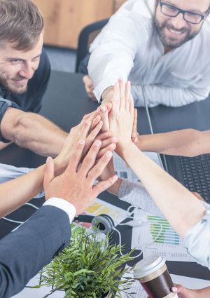 corporate staff having a high five