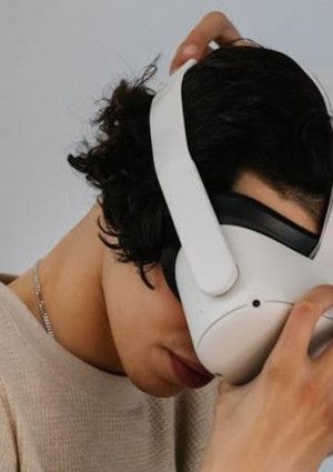 A person putting on a headset