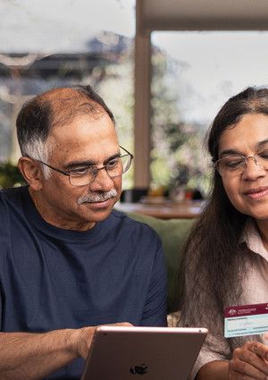 Two people looking at a digital device
