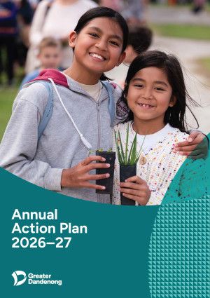 Two children holding small plants